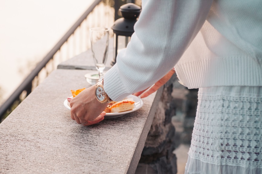 A person grabs a plate of food A person grabs a plate of food
